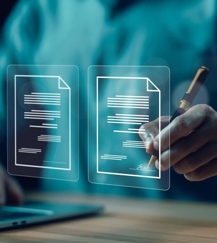 A person interacts with a laptop, reaching out with a stylus to touch virtual, transparent document icons hovering above the device. The documents display lines of text and a signature line, suggesting e-signature technology usage.